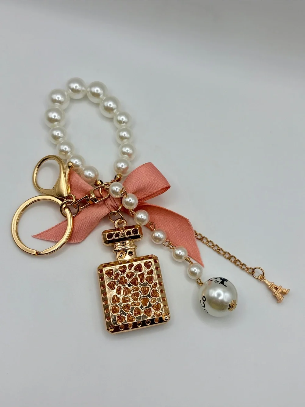 Luxe Pearl Wristlet Keychain with Perfume Bottle Charm and Pink Bow